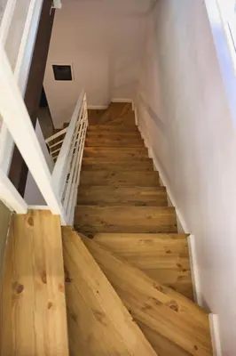 a staircase in a house with wooden floors at VFH Blue Breeze holiday home in Porticello