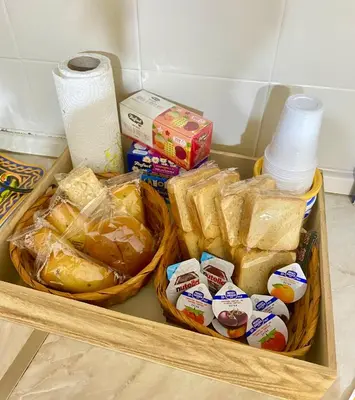 a tray filled with bread and other food in a refrigerator at La Casa del Sole in Corleone