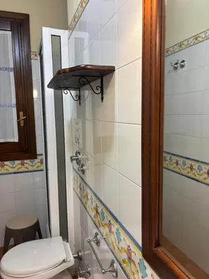 a small bathroom with a toilet and a shower at da Mimì in San Vito lo Capo