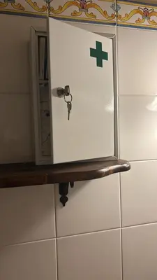 a door with a cross on it sitting on a shelf at da Mimì in San Vito lo Capo