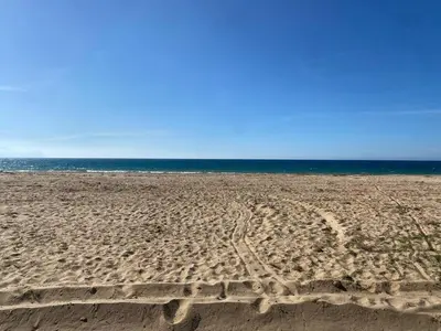 an empty beach with footprints in the sand at Casa Bluet on the Sea in Balestrate
