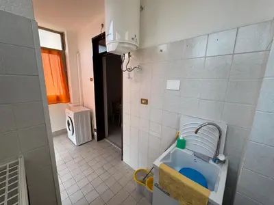 a small bathroom with a sink in a room at Castelforte House in Palermo