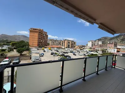 a balcony with a view of a parking lot at Castelforte House in Palermo