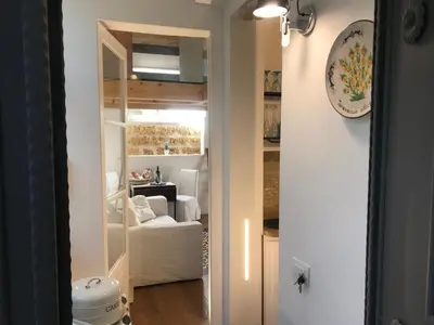 a kitchen with a counter with a coffee maker on it at Casa Ricasoli 41 in Palermo