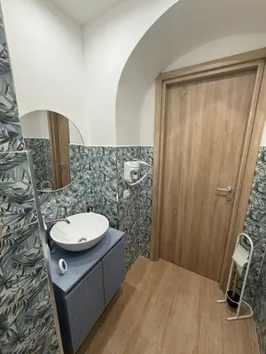 a bathroom with a sink and a mirror at La Dimora del CAPO in Palermo