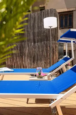 a blue ping pong table sitting on a deck at Apartment with 2 Terraces near Teatro Massimo in Palermo