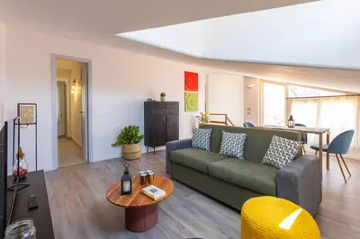 a living room with a couch and a table at Apartment with 2 Terraces near Teatro Massimo in Palermo