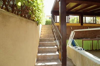 a set of stairs leading up to a building at Villa Belorizzonte - Relax & Sea in Mandra Capreria