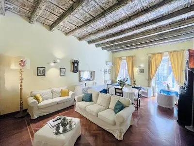 a living room with two couches and a table at Antica Palermo R&B in Palermo