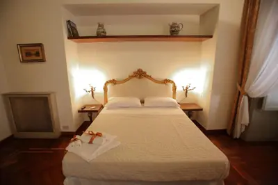 a bedroom with a bed with a white bedspread at Antica Palermo R&B in Palermo