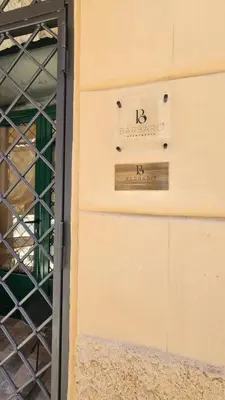 a sign on the side of a building at Barbarò Apartments in Palermo
