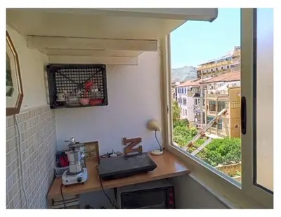 a kitchen with a window and a counter with aounter sidx sidx sidx at City-Inn II with 2 comfortable single beds in Palermo