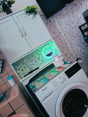 a washing machine with a box on top of it at A meravigghia Casa vacanze in Bagheria