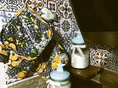 two vases sitting on a shelf next to a wall at A meravigghia casa vacanze in Bagheria