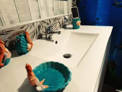 a bathroom sink with a green bowl on it at A meravigghia casa vacanze in Bagheria