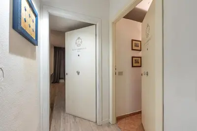 a hallway with a white door in a room at Real Umberto Apartments by Wonderful Italy in Palermo