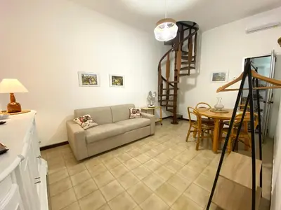 a living room with a couch and a table at Il Vialetto in Mondello