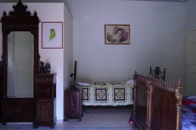 a bedroom with a bed and a mirror at Casa Tramontana Ospitalità Diffusa in Castronuovo di Sicilia