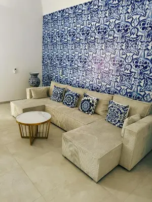 a living room with two couches and a table at Opera Dolce in Carini