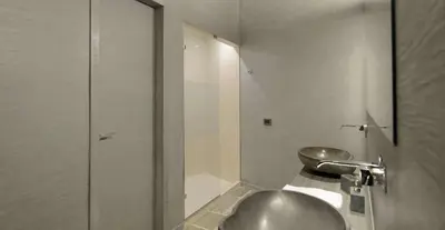 a bathroom with a sink and a toilet at Agrirelais Principe SPA in San Giuseppe Jato