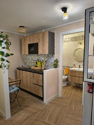 a kitchen with a sink and a bathroom with a tub at Casuzza Nica e Bedda-Centro storico in Palermo