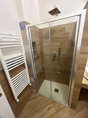 a shower with a glass door in a bathroom at Sweetpalermo in Palermo