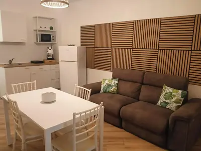 a living room with a couch and a table at Sweetpalermo in Palermo