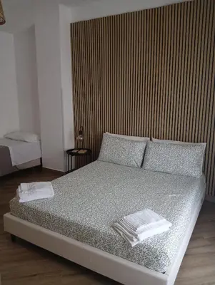 a bedroom with a bed with two towels on it at Sweetpalermo in Palermo