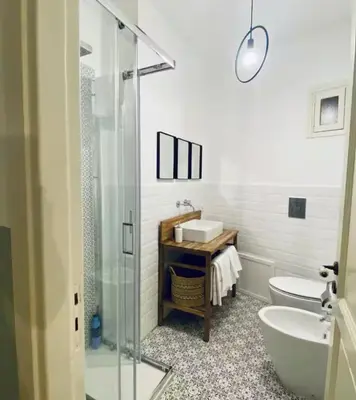 a bathroom with a sink and a toilet and a shower at Tarzana’ home in Palermo