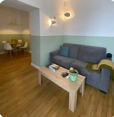 a living room with a blue couch and a table at Tarzana’ home in Palermo