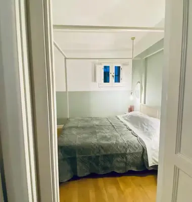 a bedroom with a bed in a white room at Tarzana’ home in Palermo