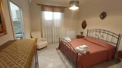 a bedroom with two beds and a window at 4 Seasons in Altavilla Milicia