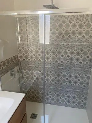 a shower with a glass door in a bathroom at 4 Seasons in Altavilla Milicia