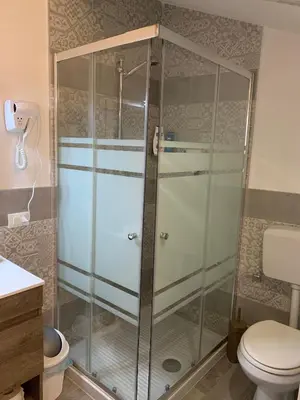 a shower in a bathroom with a toilet at U muragghiuni n3 in Lascari
