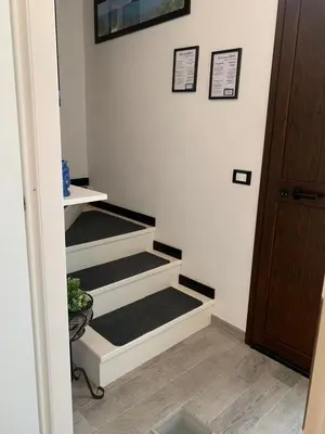 a room with three stairs in a room at U muragghiuni n3 in Lascari