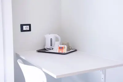 a white table with a white appliance on it at San Carlo Cuore di Palermo in Palermo