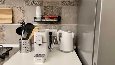 a kitchen with two coffeemakers on a counter at Chez D'Ossuna con Patio Privato - centro storico Cattedrale - ampio 6 ospiti in Palermo