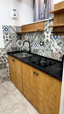 a kitchen with a sink and a stove at DiGi Home in Palermo