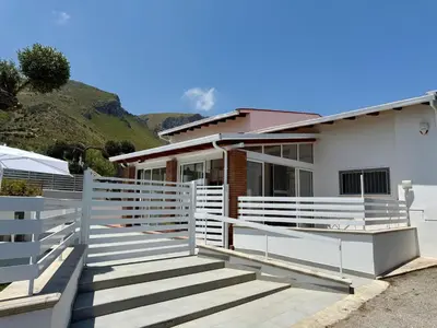 a house with a white fence in front of it at Villa GioEle - Pool & Relax in Mandra Capreria