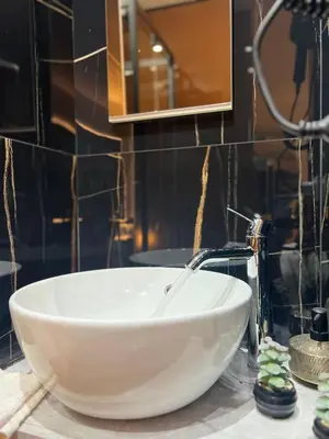 a bathroom with a white bowl sink on a counter at Armonia Serenity Room Politeama in Palermo