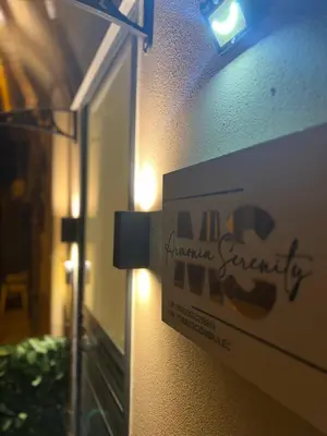 a sign on the side of a building at Armonia Serenity Room Politeama in Palermo