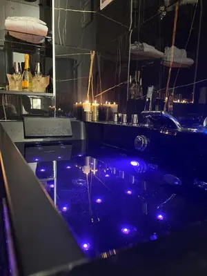 a kitchen with purple lights on a counter at Armonia Serenity Room Politeama in Palermo