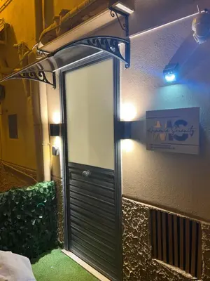 a mirror on the side of a building at Armonia Serenity Room Politeama in Palermo