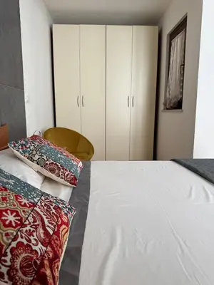 a bedroom with a bed with two pillows on it at Domus Vucciria in Palermo