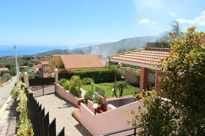 a garden with a view of the ocean at Villa Angel in Mandra Capreria