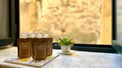a table with paper bags and a potted plant at I Paladini ORLANDO Apartment in Palermo