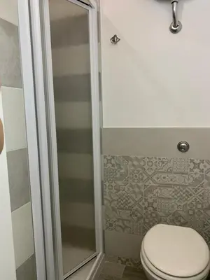 a bathroom with a toilet and a shower at U muragliuni 2 in Lascari