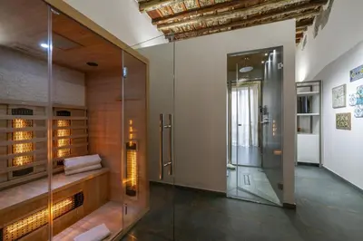 a bathroom with a shower and a glass door at Ballarooms Experience in Palermo