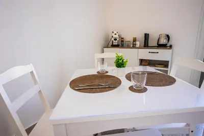 a white dining room table with two place mats at Palermo Centro Le Cupole della Felicissima in Palermo