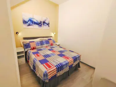 a small bedroom with a bed in a room at subway apartment in Palermo